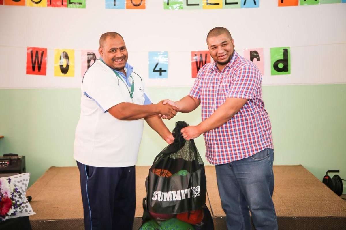 Wayne du Plessis from <a href="/WorldVisionSA/">World Vision South Africa</a> handing over donation from @SCAS to the Word4Word project in Pella