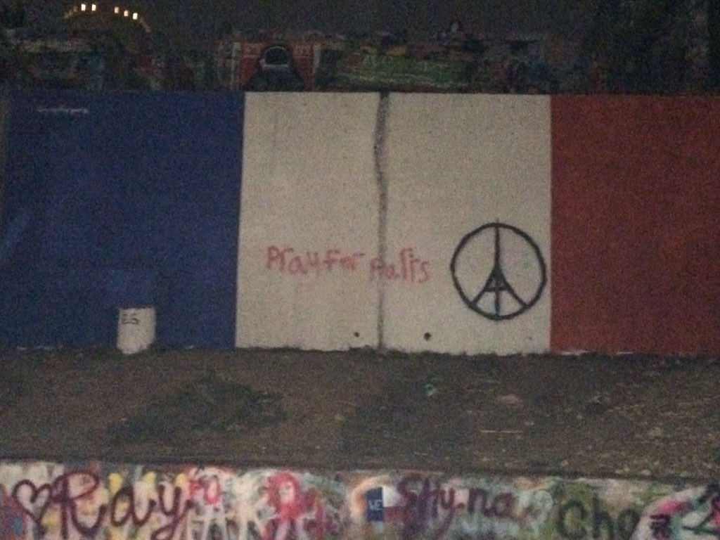 MichaelPerchick's tweet photo. "Pray For Paris" graffitied on spray painted French flag in Austin @KVUE https://t.co/3WCLdIkkuT