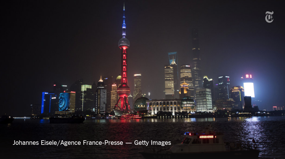 nytimes's tweet photo. Global monuments show solidarity in French colors after the Paris attacks https://t.co/8AcpHPuAJm https://t.co/URgo95eQb3
