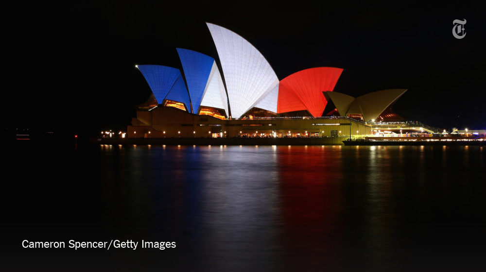nytimes's tweet photo. Global monuments show solidarity in French colors after the Paris attacks https://t.co/8AcpHPuAJm https://t.co/URgo95eQb3