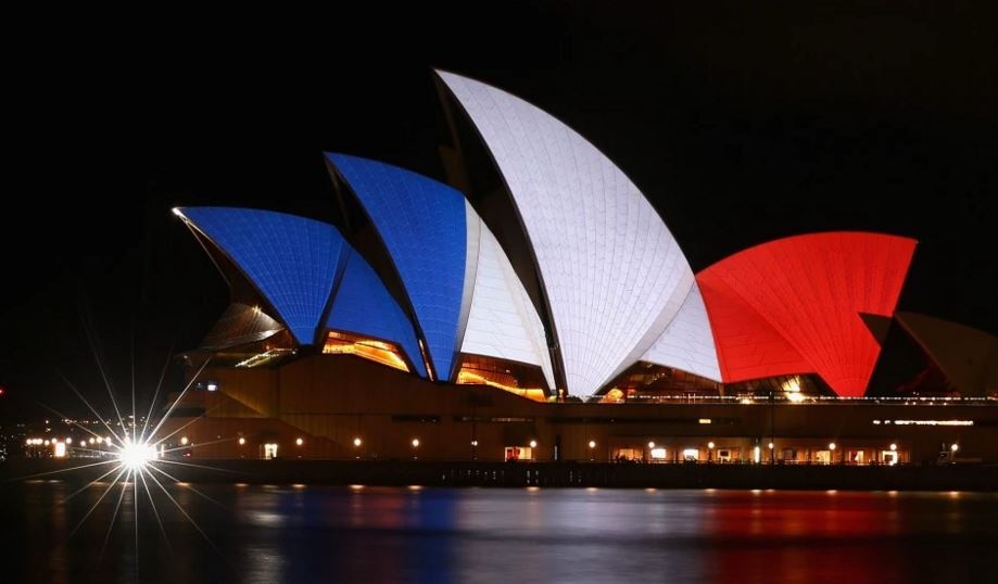 washingtonpost's tweet photo. World landmarks and buildings lit up in the colors of the French flag https://t.co/5q54H8tz6f https://t.co/USL0TARQKo