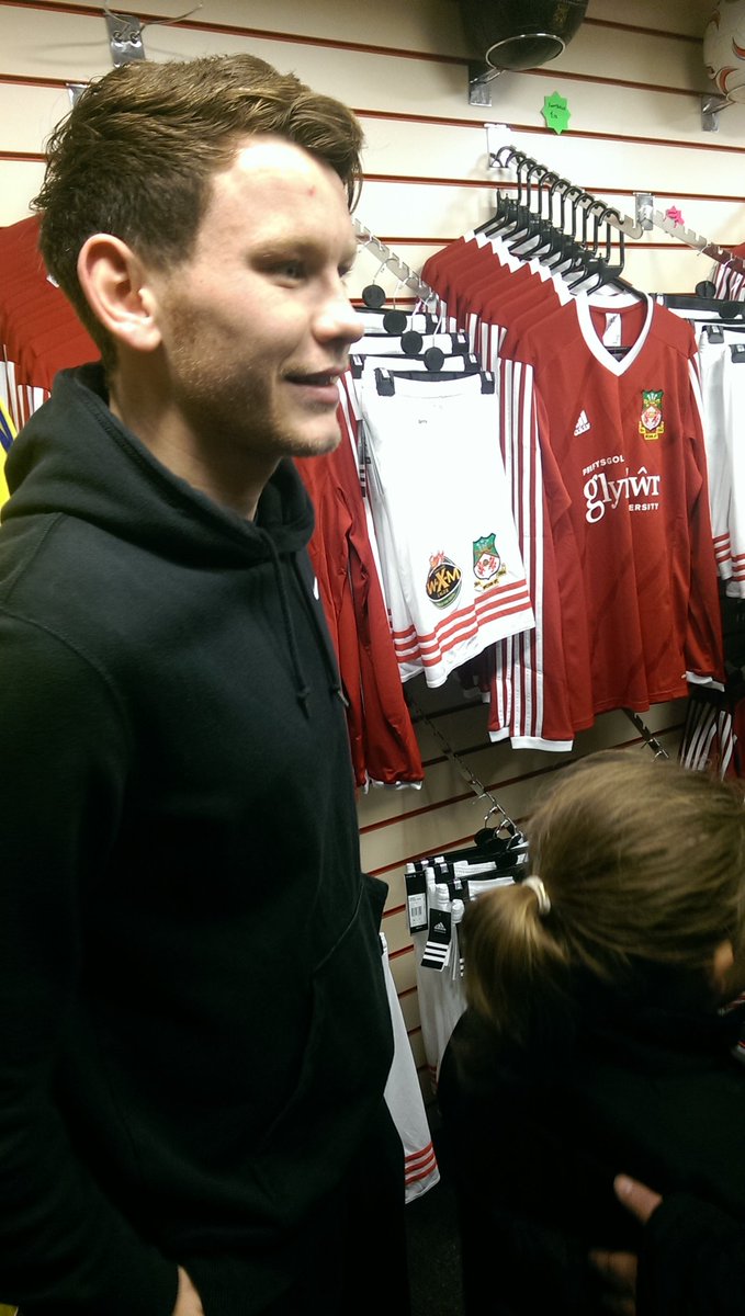 DPWrexNews's tweet photo. Wrexham captain Connor Jennings signing autographs at new shop in town today https://t.co/TmRuHSviXg
