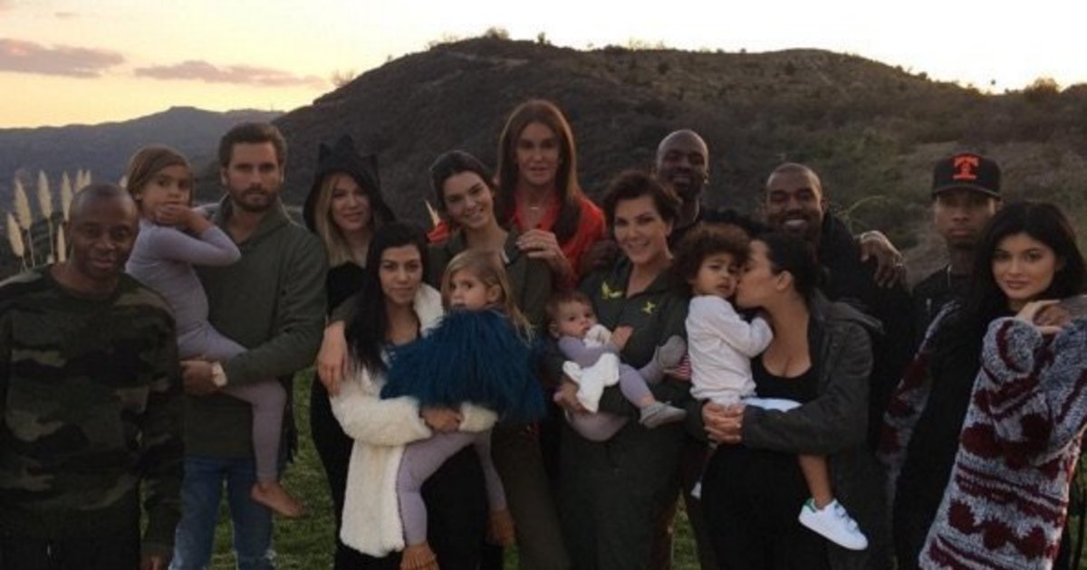 HuffPost's tweet photo. Scott Disick and Tyga somehow made it into the Kardashians' Thanksgiving photo https://t.co/Ra643GwNaz https://t.co/T432NqBjml