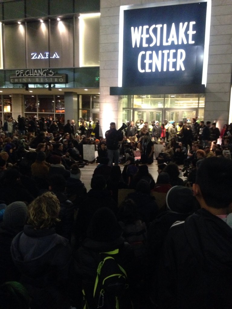 SJGTimes's tweet photo. #Blacklivesmatter Sit in now underway outside Westlake Center. Police barring doors to the mall. seatimes/1tic5e8 https://t.co/atlv0927pa