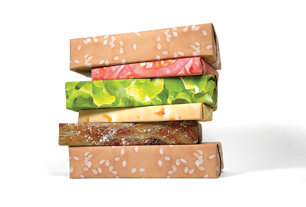 UberFacts's tweet photo. There is photorealistic wrapping paper that will make your stacked Christmas gifts look like a cheeseburger. https://t.co/NIQ2Eafwhd