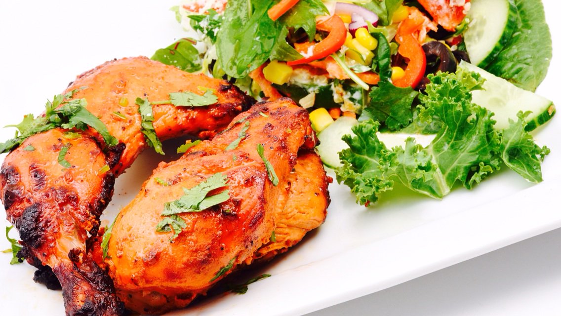 Charcoal half chicken with fresh green salad- cilantro lime dressing.