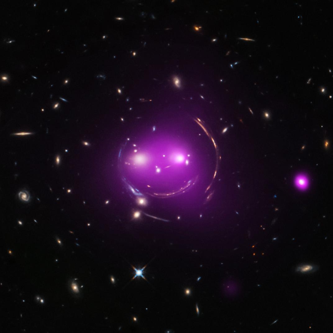 NatGeo's tweet photo. This group of galaxies is known as "Cheshire Cat." More recent space images: https://t.co/EPM6kPaR0B (Photo: @NASA) https://t.co/my4P9dyuKN