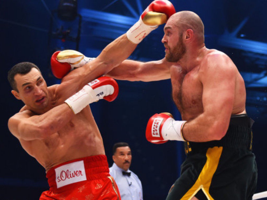 Tyson Fury wrested the world heavyweight title from Wladimir Klitschko in a 12-round unanimous decision in Germany.