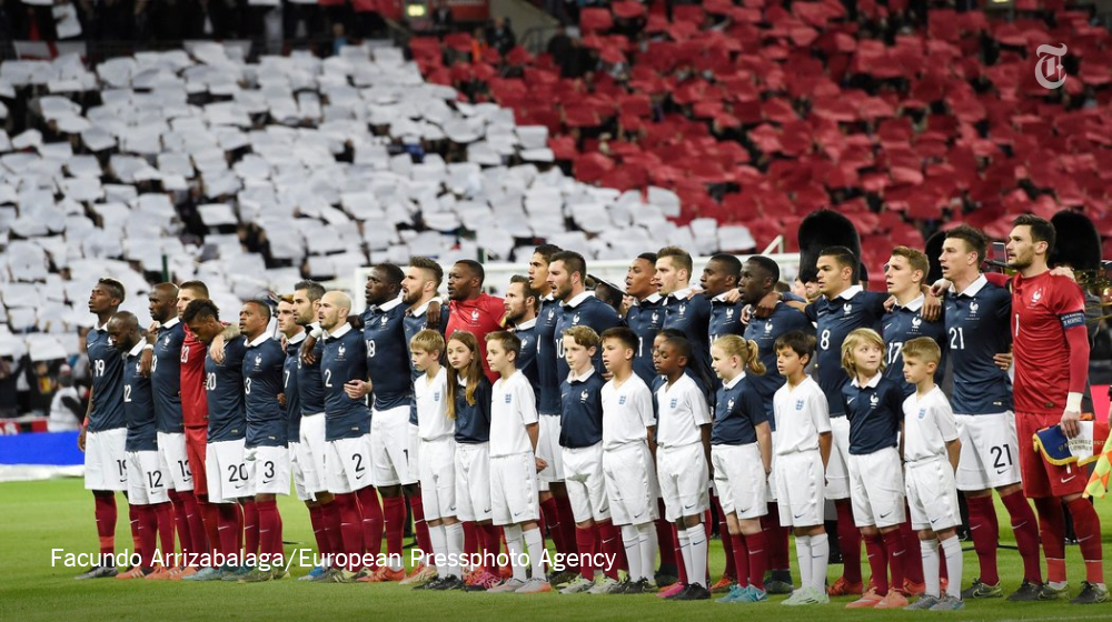 nytimes's tweet photo. A return to living. A show of unity. France receives a friendly embrace in England. https://t.co/s9W4VT5TXA https://t.co/kYW2IGFwV0