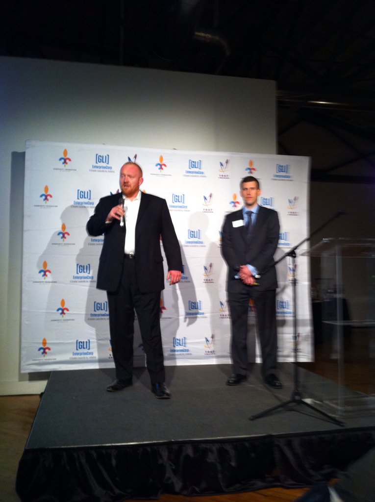 profclouse's tweet image. .@TriBlueCorp co founders Joe Alexander &amp;amp; @UofLIMBA @UofLMBA graduate Hunter Gerlach present @VogtAwards.