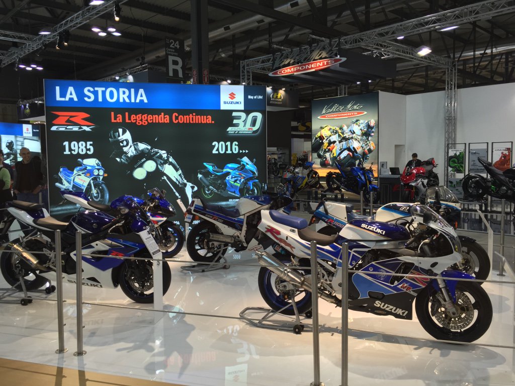 GSXRPERFORMANCE's tweet photo. Classic GSX-Rs on display at the EICMA show in Milan today! #GSXR30YearsofPerformance #GSXR https://t.co/Kybwn5ol4G