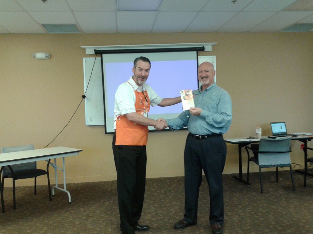 HDI associate Jim receiving a Homer award for creating a 10 PK for his teammates to share at our TA stores.