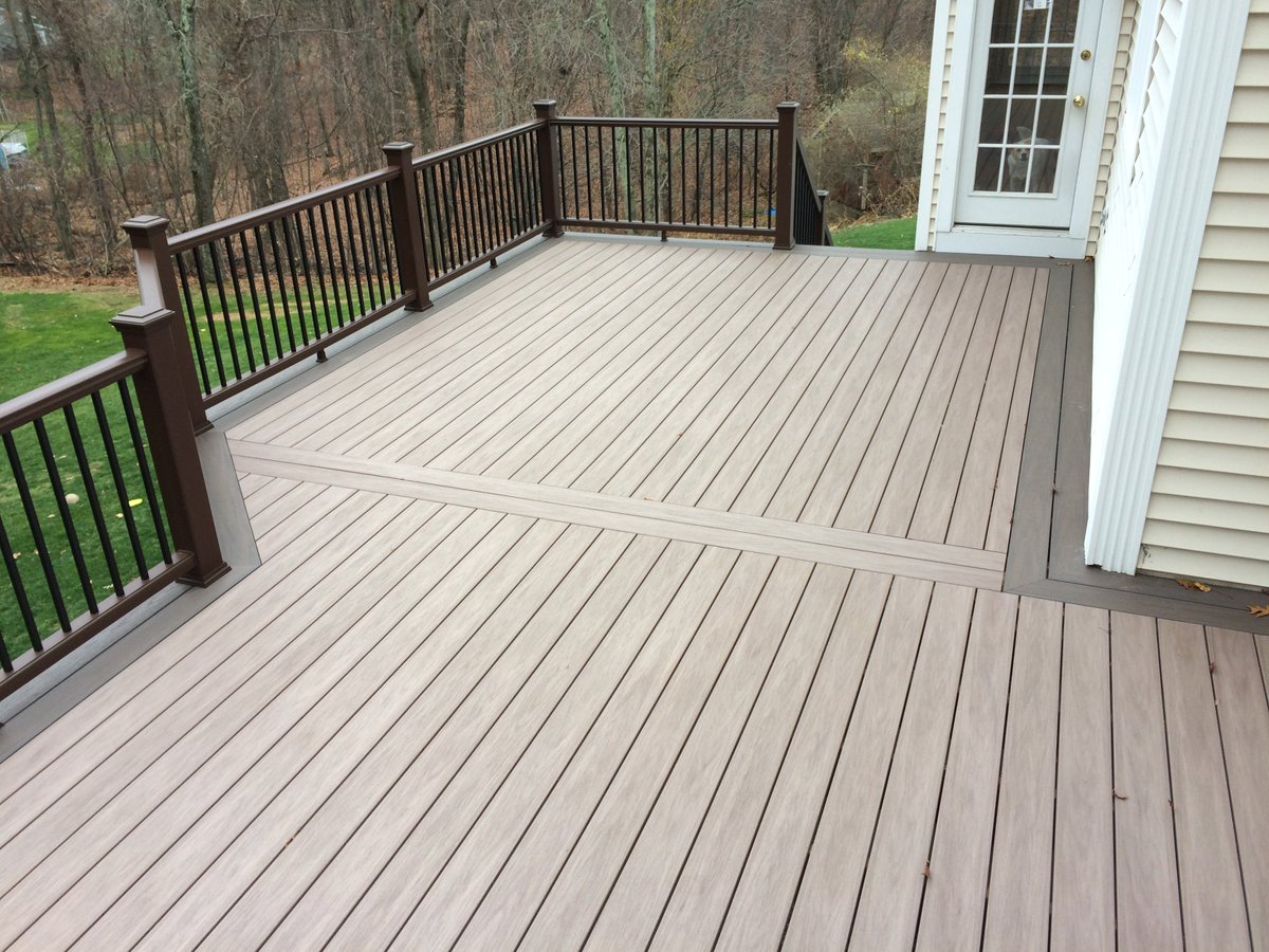 Wolf Deck n Weathered IPE &amp; Black Walnut. Trex Transcends railing with black aluminum balusters &amp; island caps. Nice!
