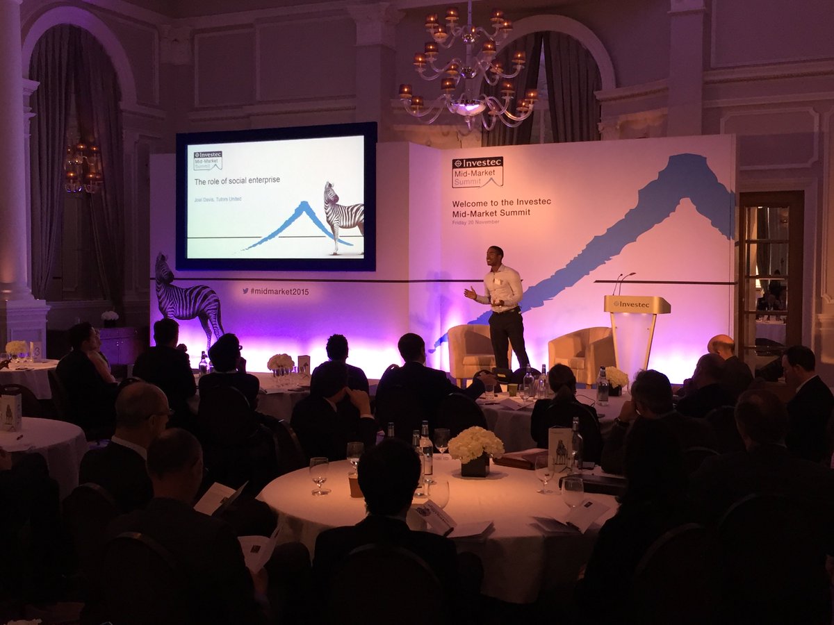 Investec's tweet photo. Joel Davis from @Tutors_United inspires while speaking through the role of social enterprise #midmarket2015 https://t.co/slQ7zRdXzB