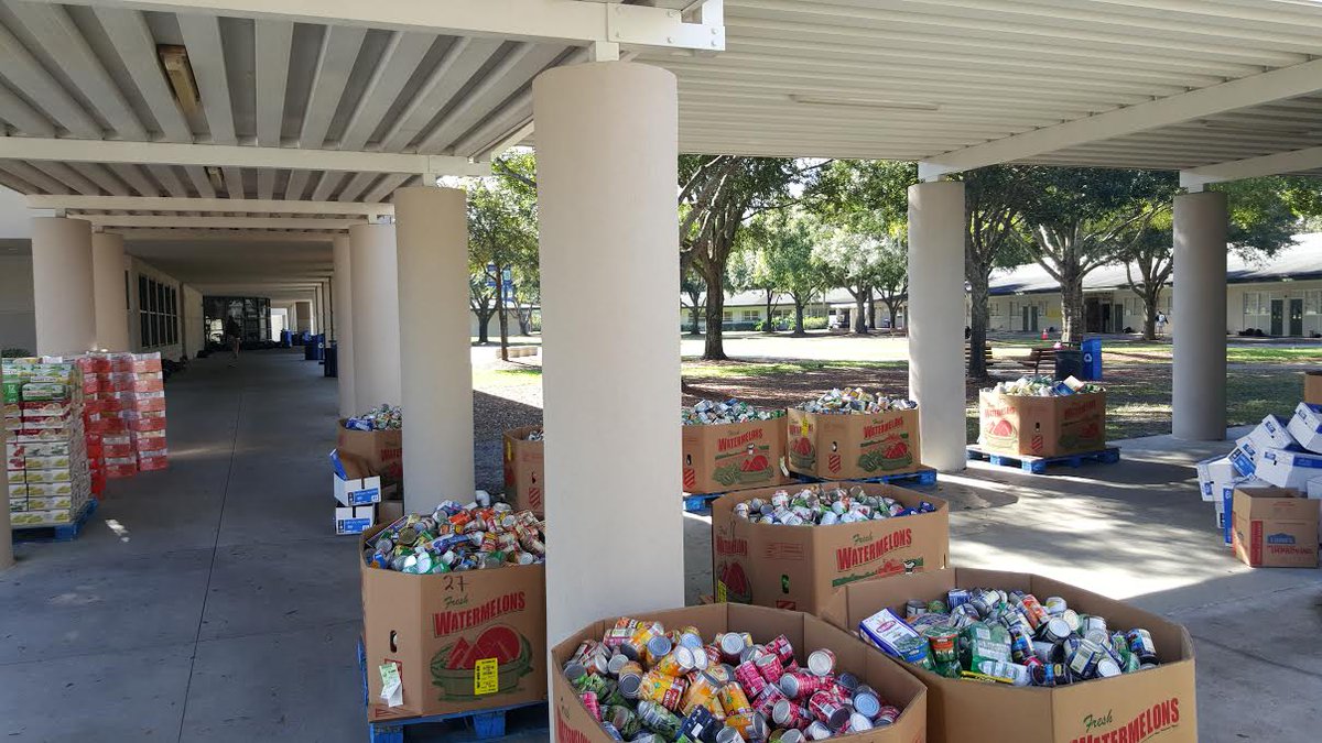TrinityPrepFL's tweet photo. Second Harvest stopped by today to pick up hundreds of cans of food donated through our #CANstructions! #TPSCares https://t.co/h0f9gnF1lH