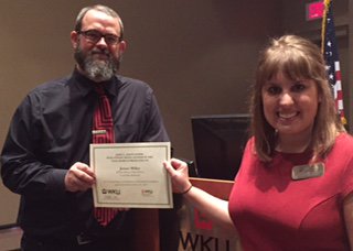 WKU_SMC's tweet photo. James Highland Adviser of 2015 James Miller @dupontcrimson is given his award by Charlotte Turtle, JSD Coord.#jsd15 https://t.co/3gaTdHkGt9