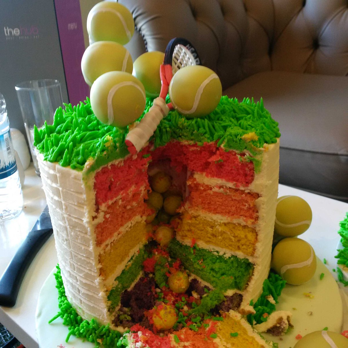 The Ultimate Tennis Cake. Filled with tiny tennis balls + choc cake pops + <a href="/head_tennis/">HEAD Tennis</a> bat Lovefuncakes.co.uk