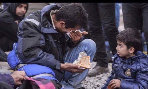 drumsplss's tweet photo. a syrian refugees feeding his son while he's wiping his dad's tears who's crying due to the lack of food https://t.co/z4K88twY09