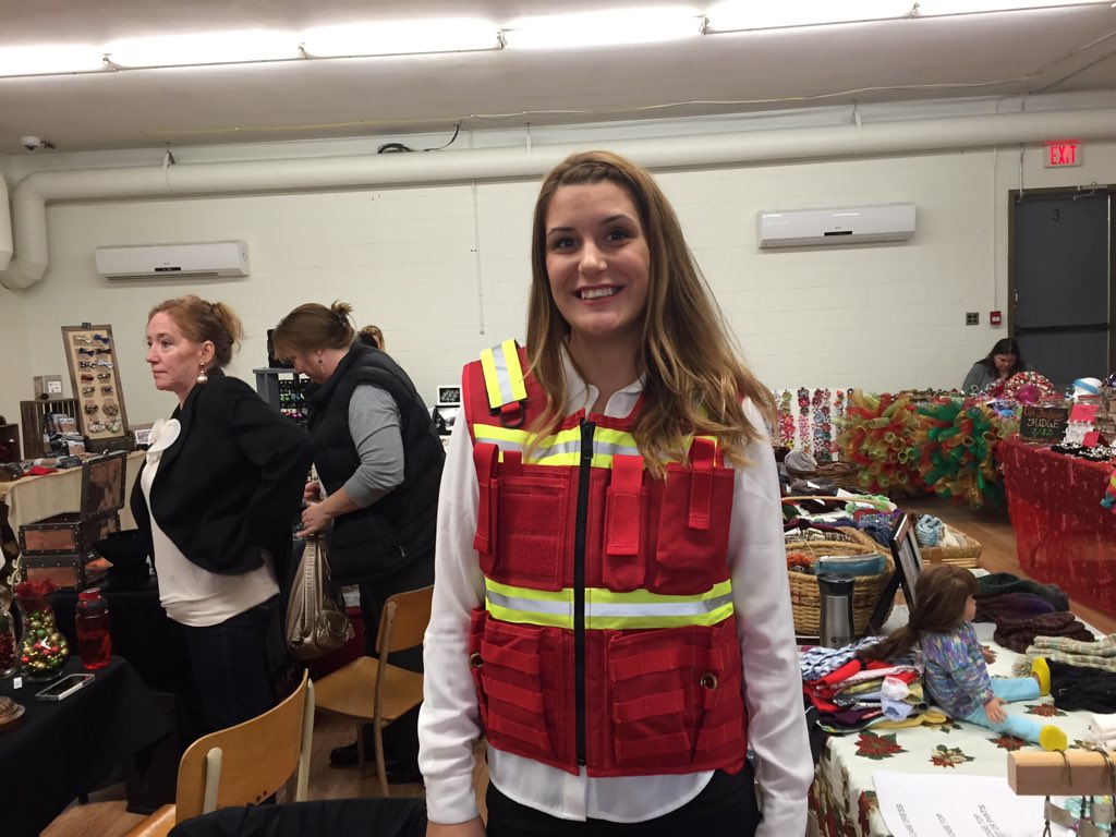 ReprtrPatHealey's tweet photo. Danielle Marsh demonstrates a construction/surveyor vest her #ElmsdaleNS company offers; looks great #EastHants https://t.co/Rgt44tqubd