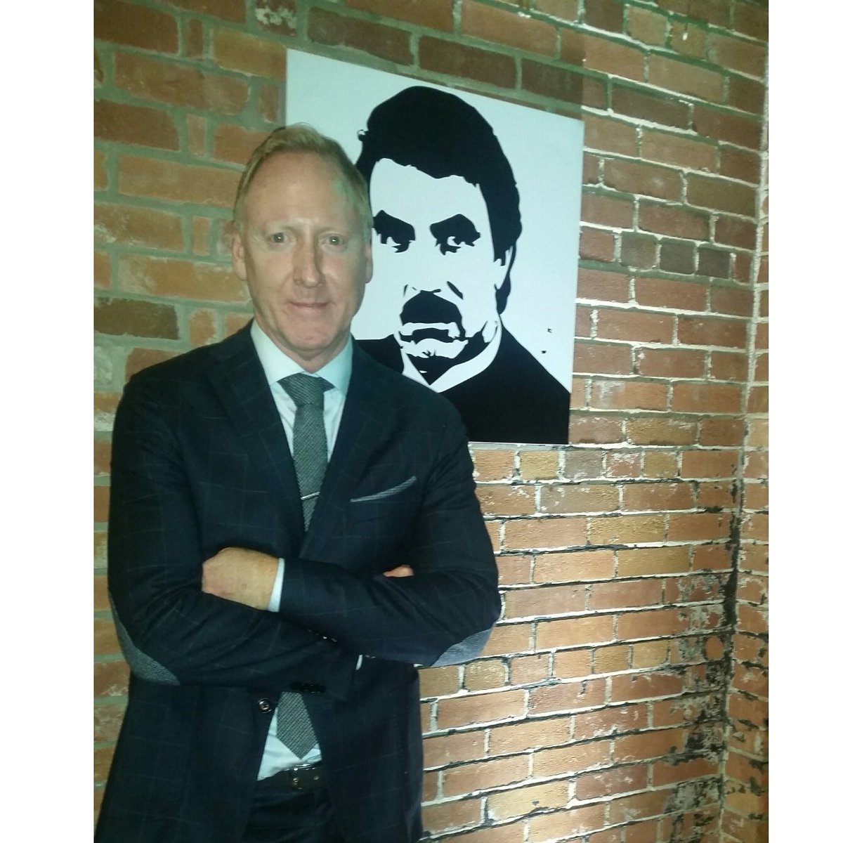GlenBaxterTO's tweet photo. If you don't have one of your own, you stand next to portrait of legendary one #mustache #suitsandstaches #Movember https://t.co/KqfxZ2jAYa