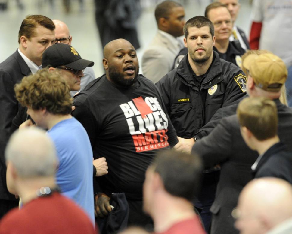 Black lives matter thug tossed from Trump rally VIDEO