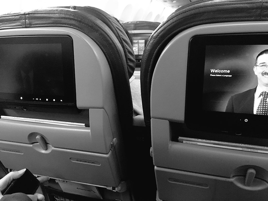 taquitos's tweet photo. We each get privacy screens on our seat backs. Wait, no, it's so you can't share a movie #JustAAThings @AmericanAir https://t.co/D6EfL223IZ