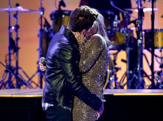 enews's tweet photo. Well, damn! Meghan Trainor and Charlie Puth's #AMAs performance got pretty steamy: https://t.co/i2RGejuGzV https://t.co/h6LUquxaJZ