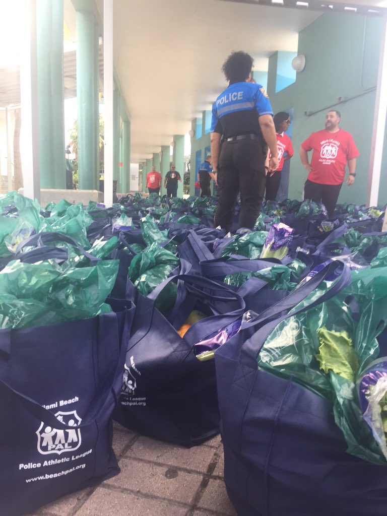 MiamiBeachPD's tweet photo. MBPD is loading the truck to feed needy families for #Thanksgiving. #MBPAL https://t.co/QGjEHyH6EO