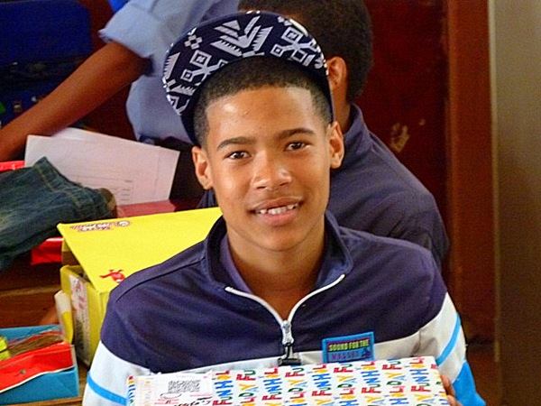 SantaShoebox's tweet photo. Another very happy young man with his new cap :) #SSB2015 https://t.co/VBZTWAsk0A