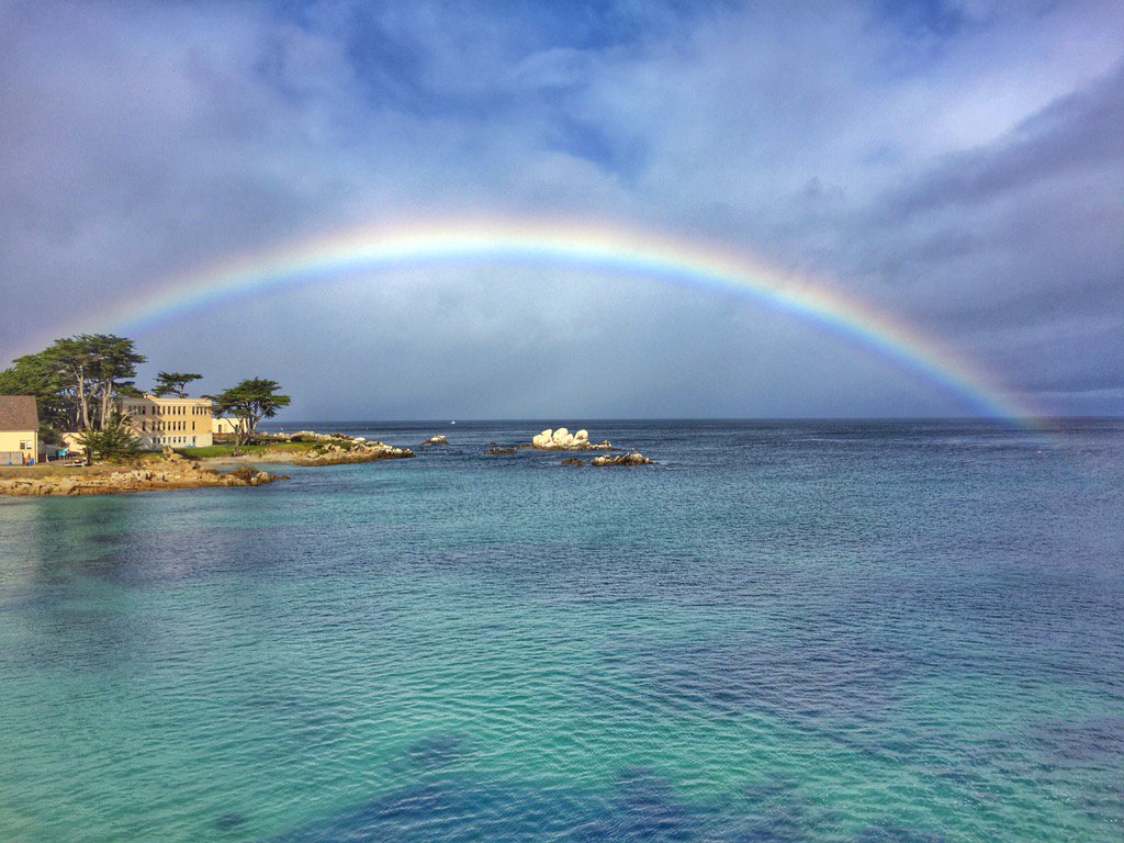 Keep looking up. You never know what you'll see. #rainbow #seemonterey