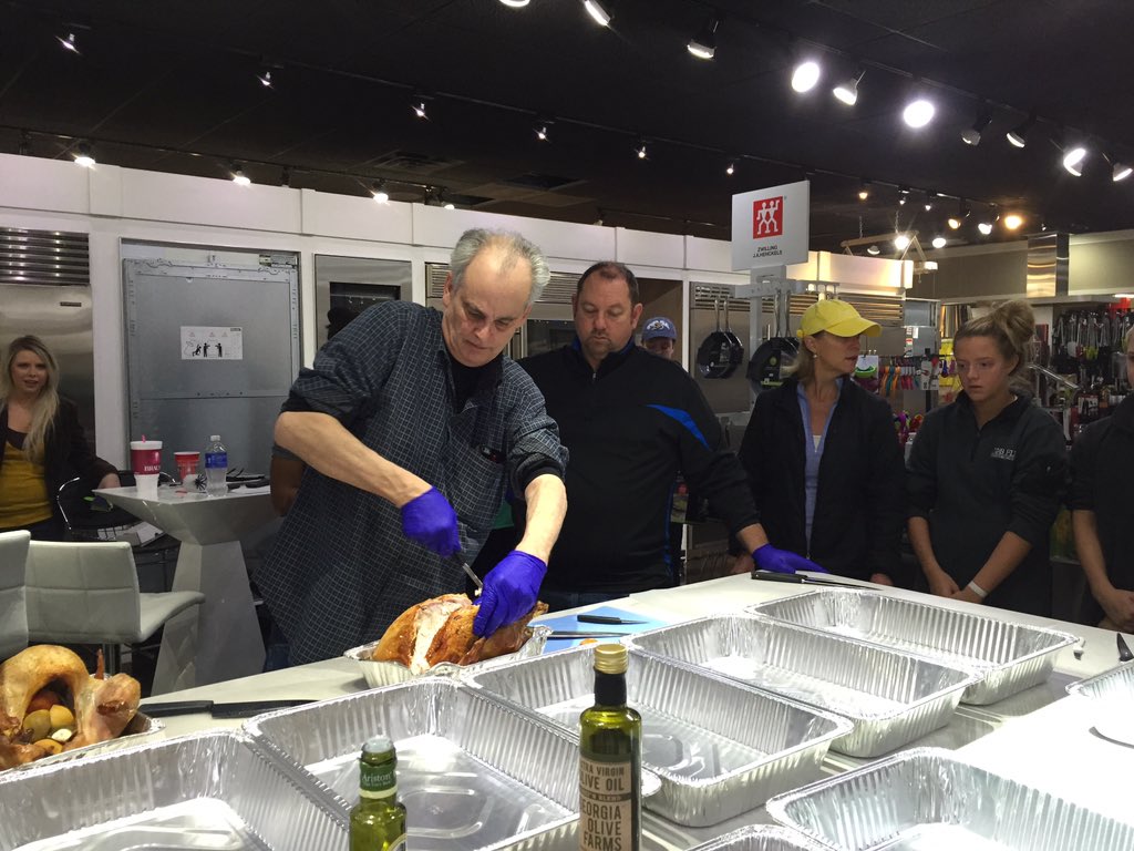 DanielleDunnOKC's tweet photo. Claude with @CulinaryKitchen giving @HomelessOKC volunteers a lesson in #turkey carving. @OKCFOX #Thanksgiving https://t.co/8rw5UeEQGK