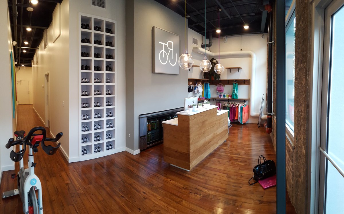 Our latest #designbuild: custom millwork, furniture, signage for Tour Cycle Studio #nola. #retaildesign #spinning