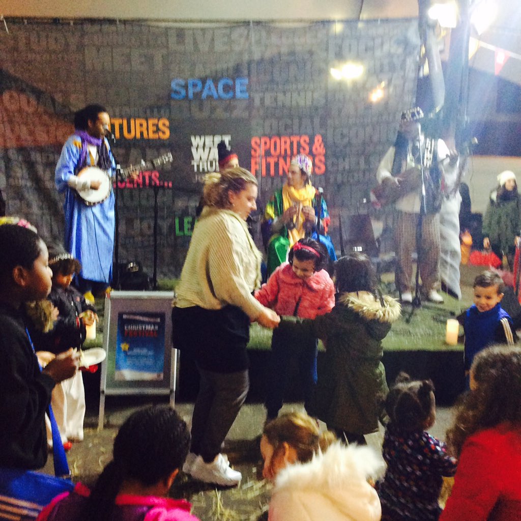 We're having a blast under the canopy- dancing to some great Moroccan music from Timtar!