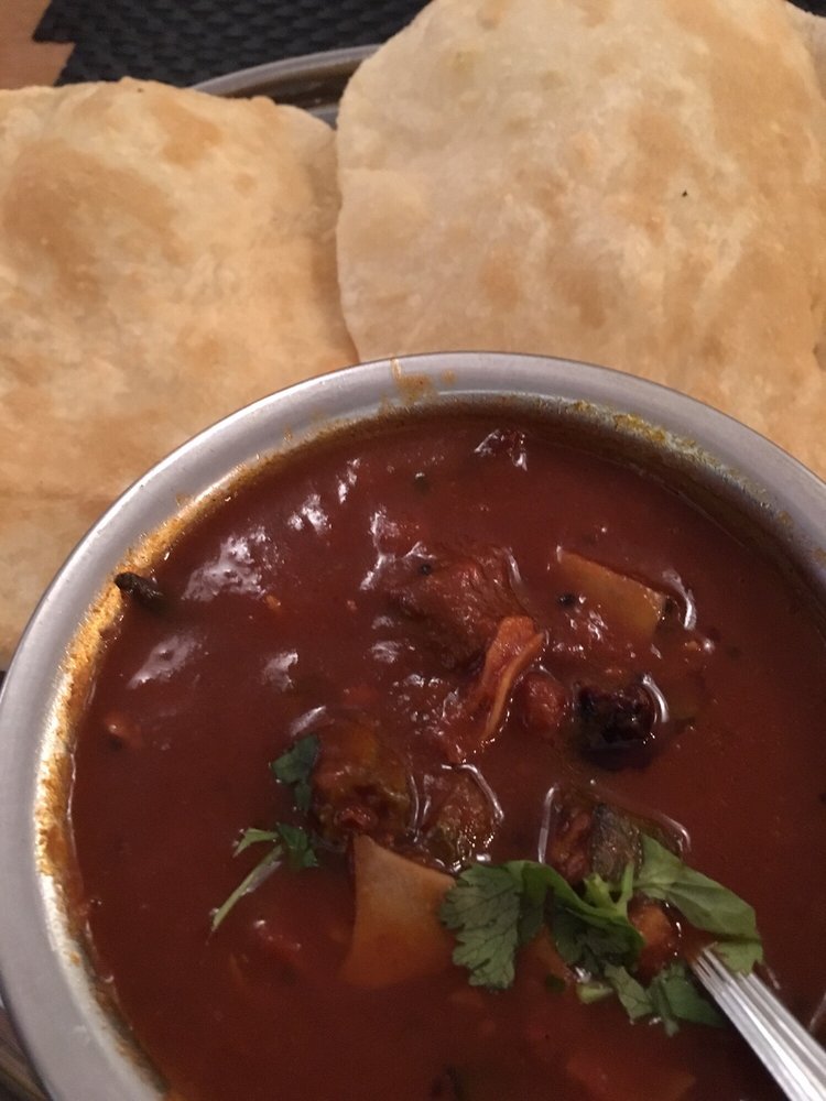 dosainyc's tweet photo. Okra &amp; chickpea stew in spicy tamarind sauce with poori bread https://t.co/yOS7GHIEYh