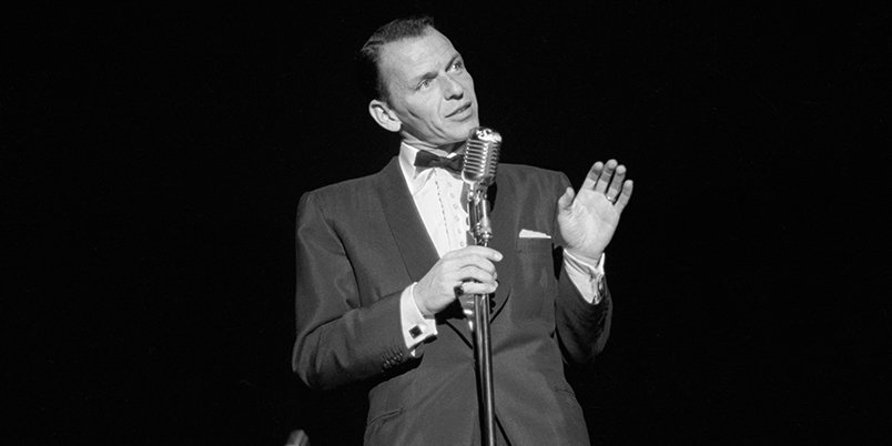 Vegas's tweet photo. Frank croons at The Sands in Las #Vegas, c. 1953. #Sinatra100 #ThrowbackThursday #tbt Photo: @LVNewsBureau https://t.co/ltxxN2UUiM