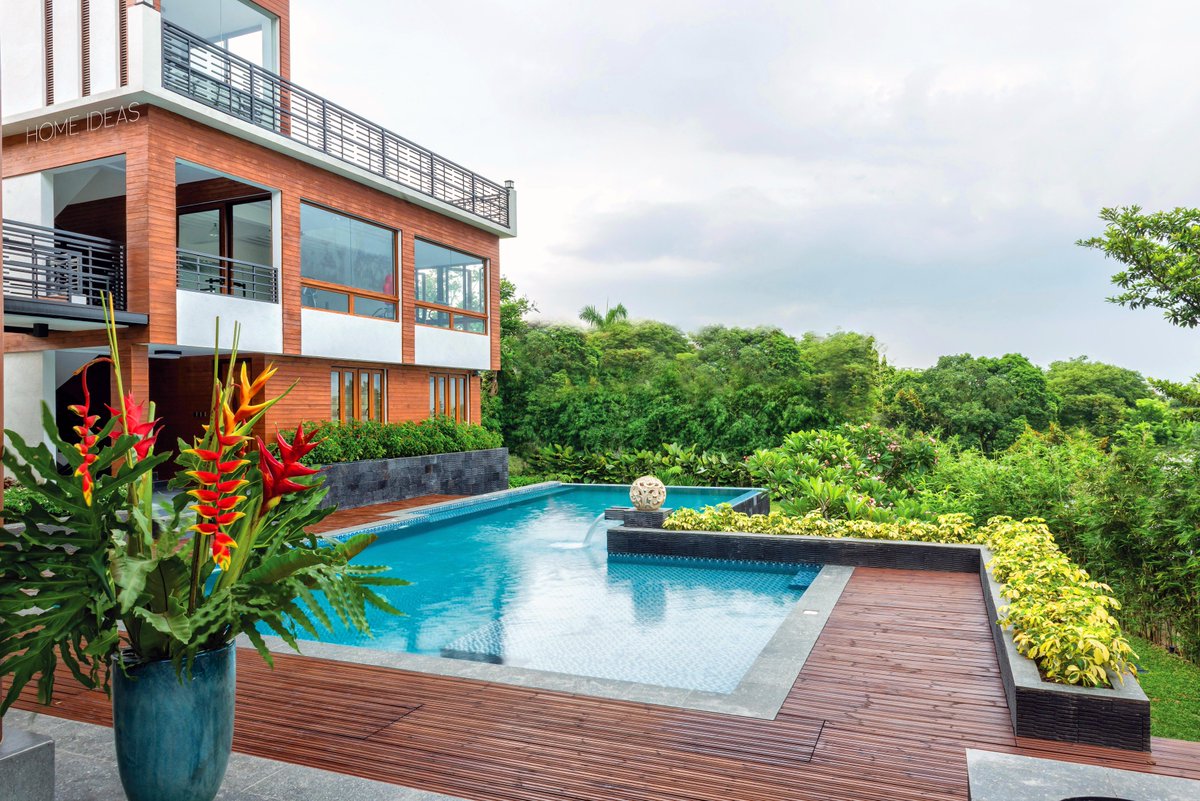HomeIdeasMag's tweet photo. #Tropicalhouse in the mountains double up on #view and comfort.A #wood #deck gives a warmer and more #comfy look. https://t.co/baq2lI6mV6