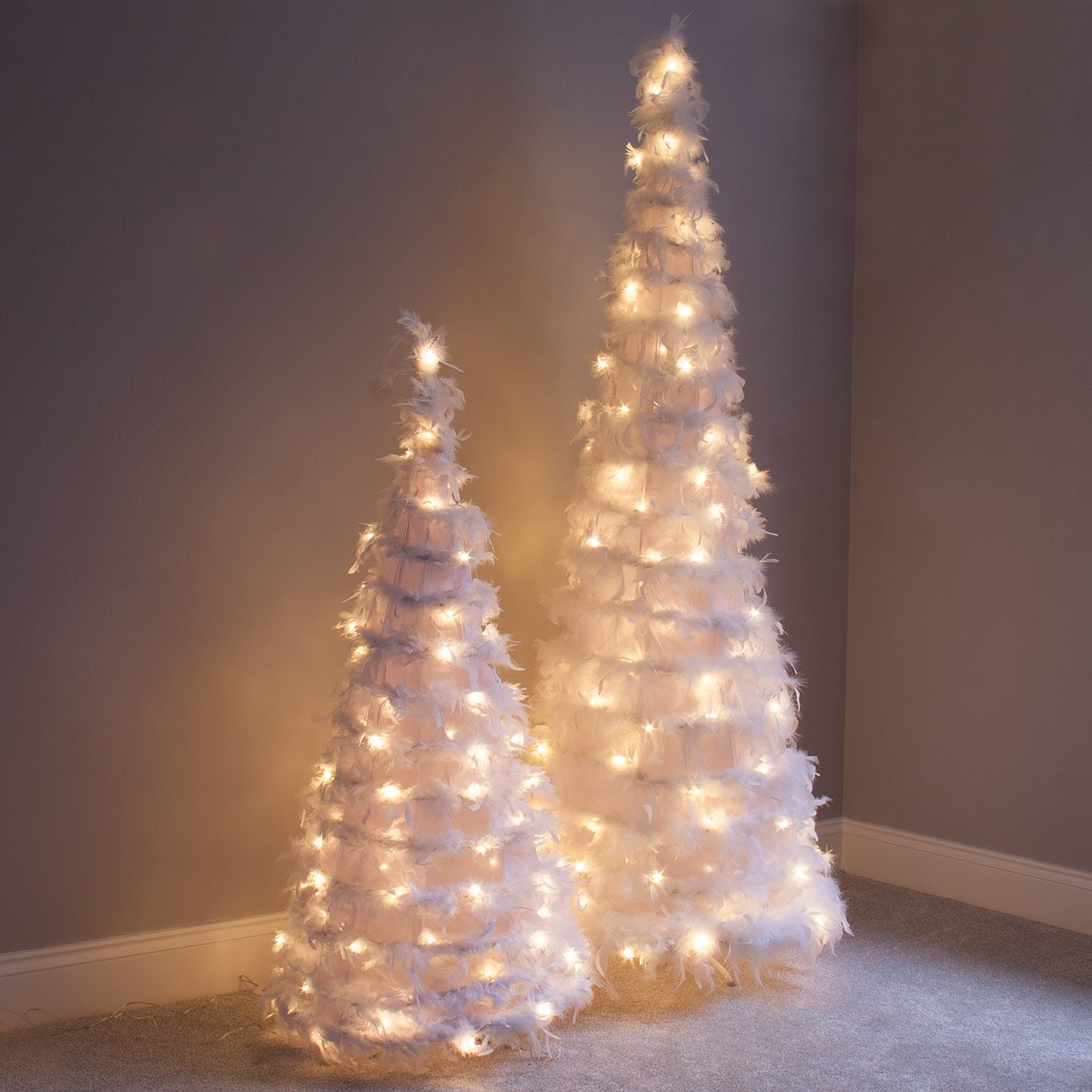 QbisUK's tweet photo. Only 6 sets left of our 1.8m #FeatherChristmasTree left. Be quick! https://t.co/8jfKUd3edL https://t.co/gHpTQwFX2k