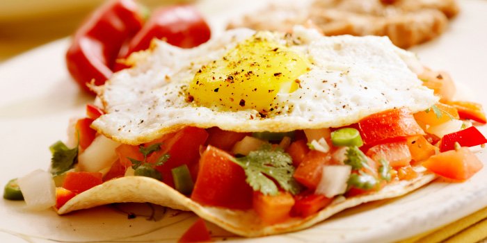 Put a Mexican twist on your breakfast with this savory huevos rancheros recipe. bit.ly/1RIq9ie