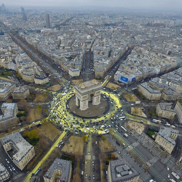 TheEconomist's tweet photo. From Instagram: A Greenpeace protest at the Place de L'Etoile, Paris, France, Dec 11th https://t.co/Q8DdnpJrrd https://t.co/21kcjBicdN