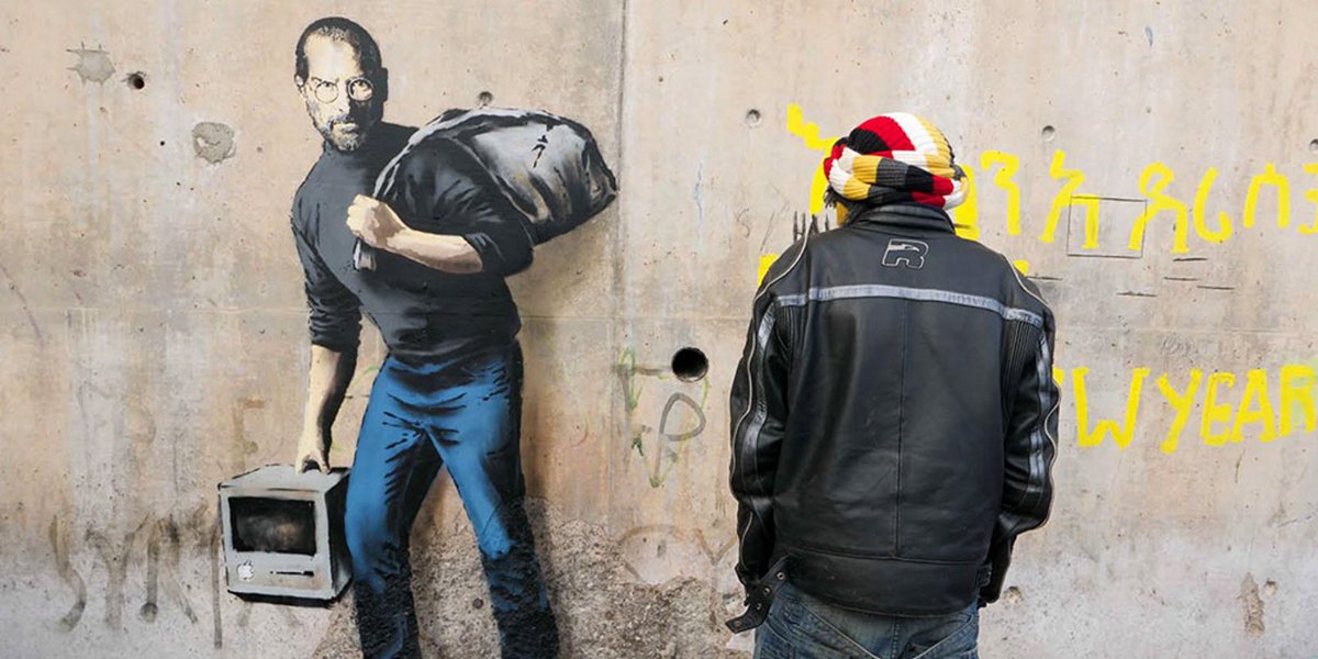 thenextweb's tweet image. Banksy uses new Steve Jobs artwork to raise awareness about stigma and plight of refugees tnw.me/48IGVwt