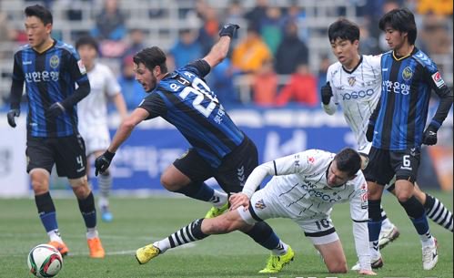 Ristic competes for the ball