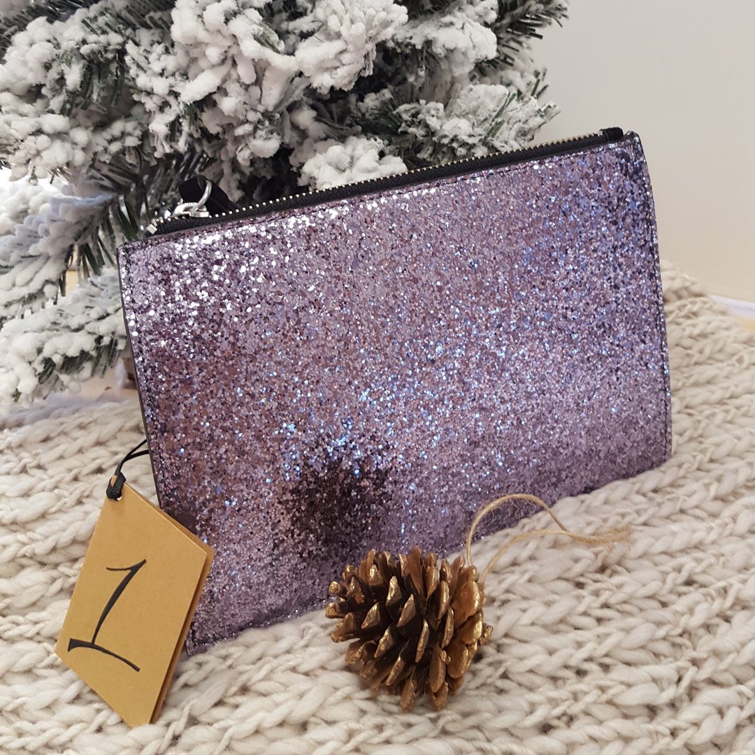 Phase_Eight's tweet photo. We are starting 12 Days of Christmas with the Millie pouch. RT &amp; follow for a chance to win! #ChristmasbyPhaseEight https://t.co/eHPCqX7f56
