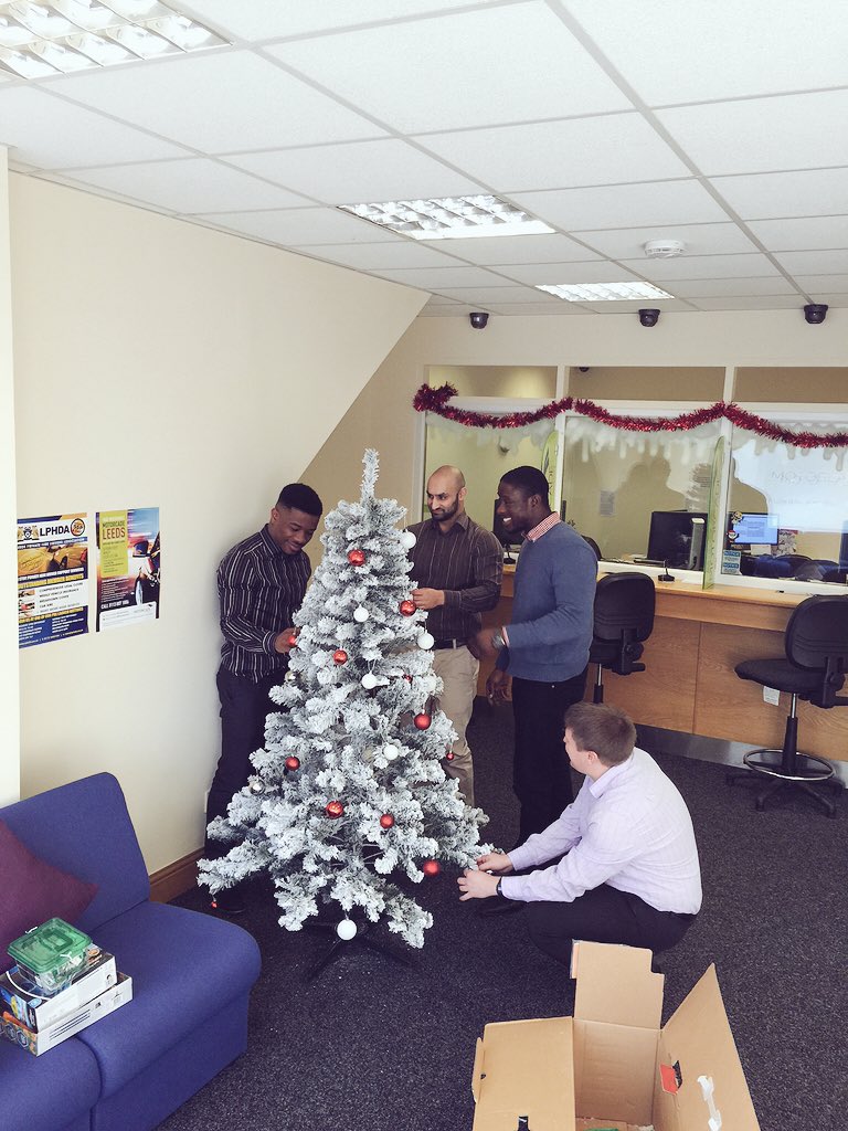 How many team members does it take to put up the Christmas tree? Four. It takes four staff members.