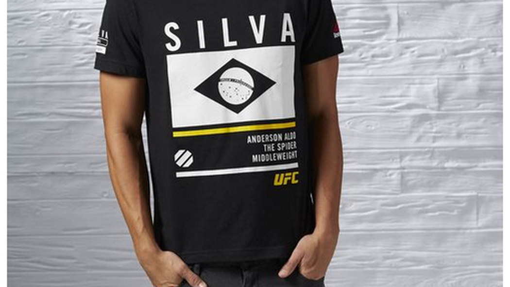 BloodyElbow's tweet photo. Reebok cites printing facility error for 'Anderson Aldo' UFC t-shirts https://t.co/vepd8Jmhjd https://t.co/lPX8ZZXBl8
