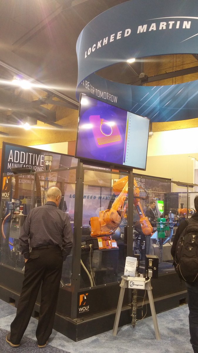 AmericaMakes's tweet photo. #AMmembers @LockheedMartin #WolfRobotic teamed w/ our @utep partner to display factory of future at #DMC_2015 https://t.co/l8I6f9dNxj