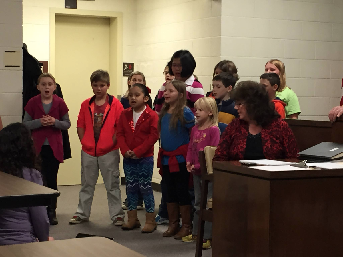 KarenAuton's tweet photo. DES Chorus leading the pledge and singing songs from their concert at the Town of Drexel Meeting. #Deswolverines https://t.co/Kpch0jHeo8
