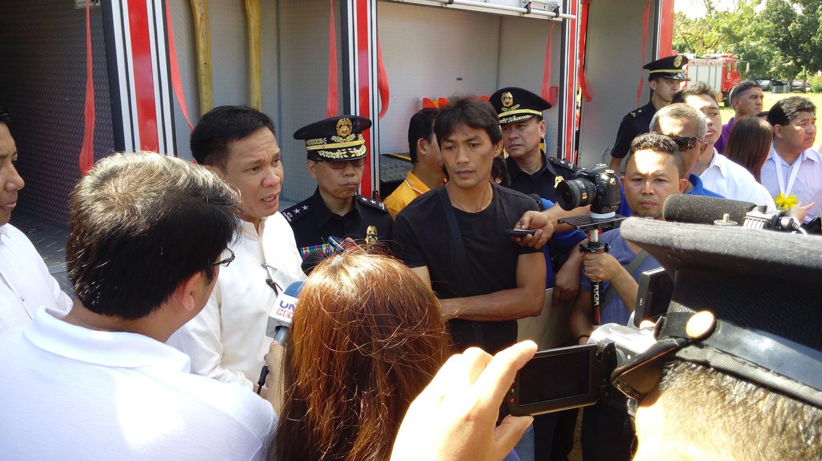 rbmarcial's tweet photo. SILG Mel Senen Sarmiento being interviewed by media during the turn over of 120 newly acquired fire trucks of BFP https://t.co/hUyEobmheq