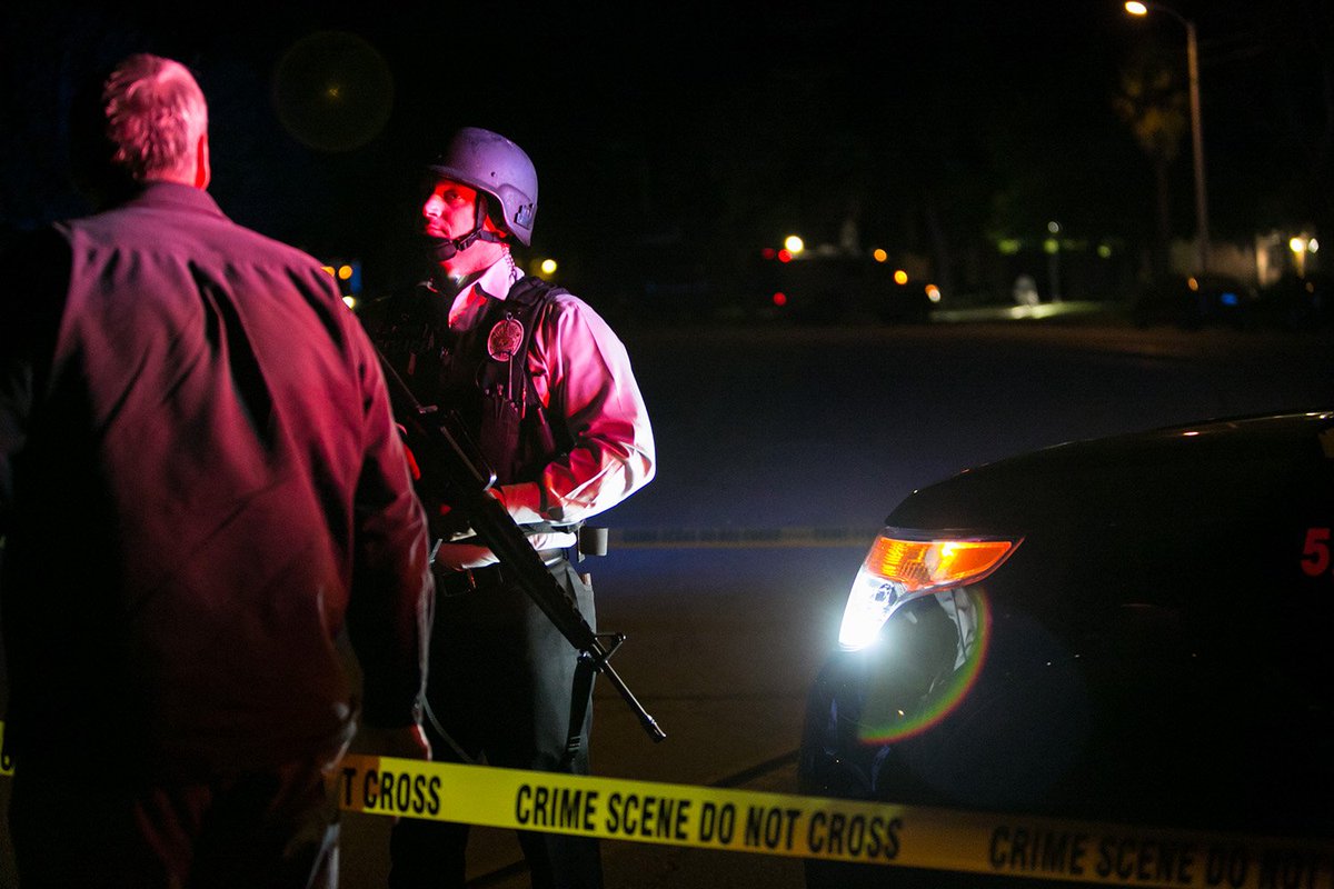 Law enforcement officers wearing tactical gear in Redlands. (Marcus Yam / Los Angeles Times)