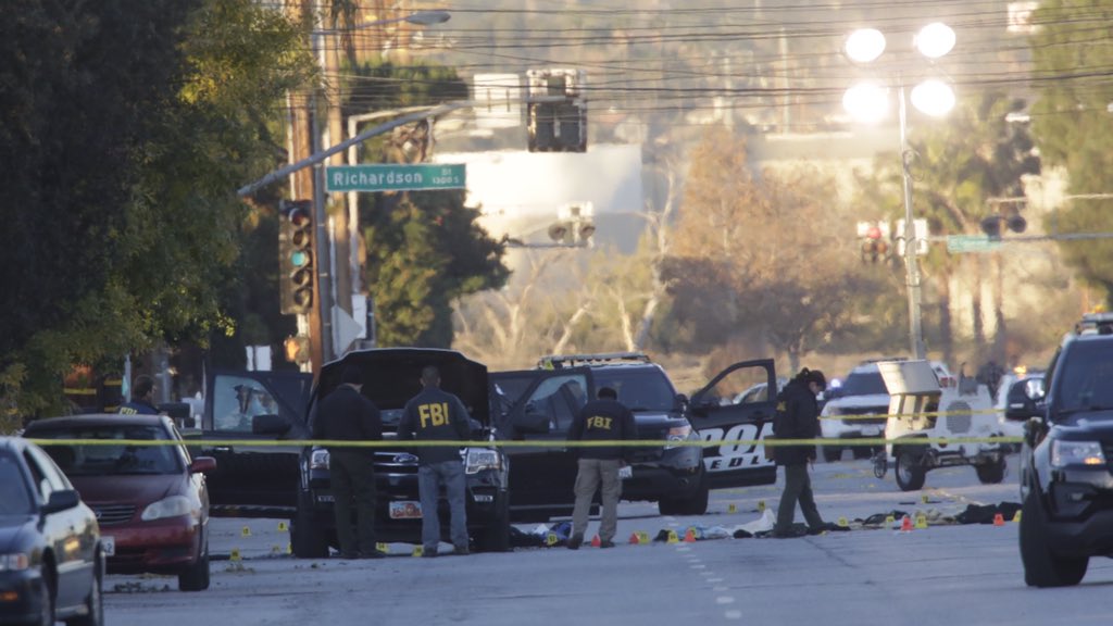 Law enforcement officers investigate site of San Bernardino Avenue where Tashfeen Malik and her husband were killed. (Irfan Khan / Los Angeles Times)