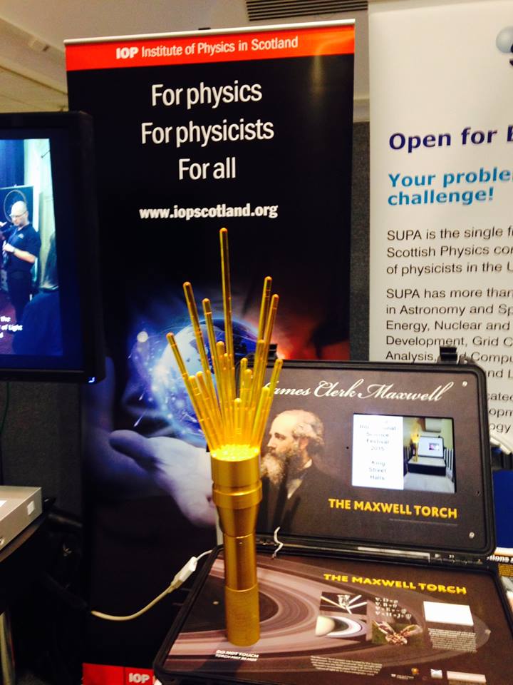 UofGPhysAstro's tweet photo. The @IOPScotland #MaxwellTorch looking good, at the @light2015scot @IYL2015 closing event, @HeriotWattUni 2/12/15 https://t.co/kQmu6UCMFV